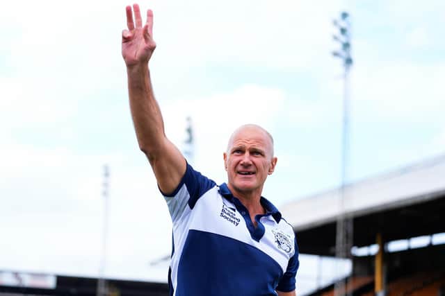 Coach Brad Arthur waves to Leeds Rhinos' travelling fans after his side's 64-6 win at Castleford Tigers. Picture by Olly Hassell/SWpix.com.