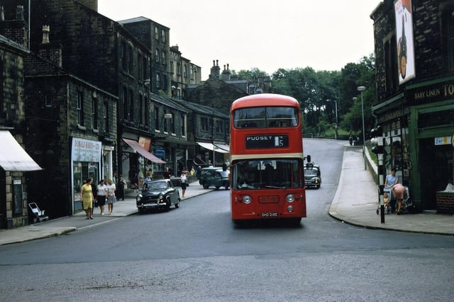 A Pudsey bus (Yorkshire No. 5) passing through Morley Bottoms in August 1967. The view is looking up Scatcherd Hill and shops prominent on it are Donald Hardy, electrical goods, Thompson's newsagents and Misses Toulman, baby linen