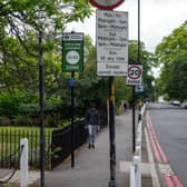 An Ultra Low Emission Zone (ULEZ) sign is displayed at the entrance to the zone in London.
