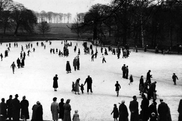 The Upper Lake in winter of 1958. The late is frozen, many people on the ice, possibly even skating.