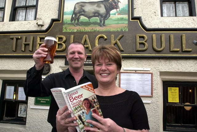 Landlords John and Val Ward celebrate after The Black Bull won a CAMRA award in March 2003.