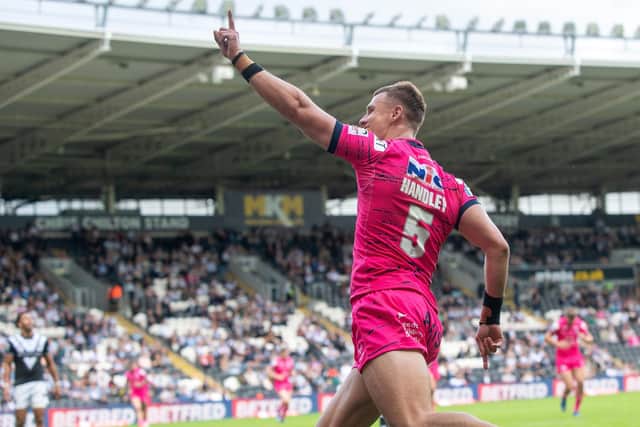 Ash Handley salutes Rhinos' fans after scoring against Hull. Picture by Bruce Rollinson.