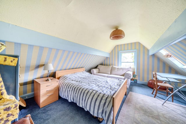 The second floor has three charming attic style bedrooms with sloping ceilings and an additional shower room.