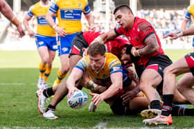 Morgan Gannon scores for Leeds Rhinos in their Super League round two win at Salford Red Devils. Picture by Allan McKenzie/SWpix.com.