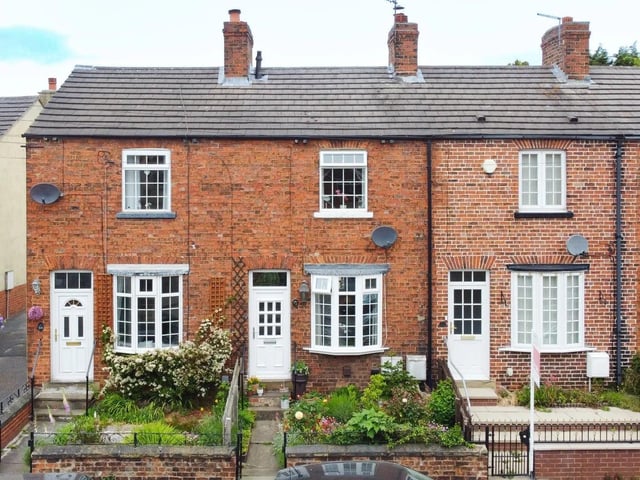 The mid-terrace home is a highly sought-after village location.