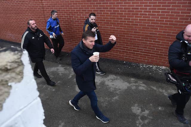 Former Leeds United head coach Jesse Marsch (C) gestures as he arrives ahead of the English FA Cup fourth round football match between Accrington Stanley and Leeds United at the Wham Stadium(Photo by PETER POWELL/AFP via Getty Images)