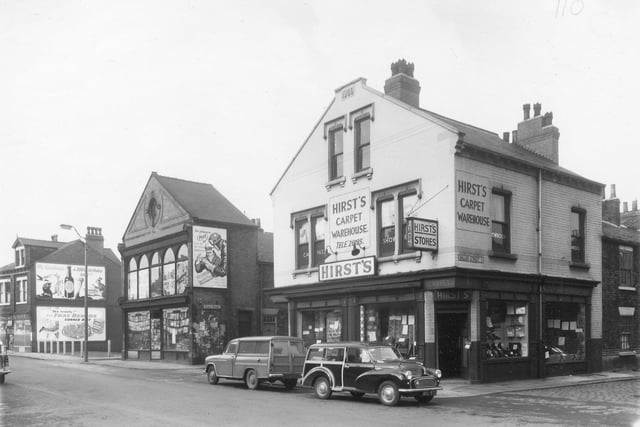 Shops on Beeston Road in April 1959. In focus is a cycle shop and Hirst's Carpet Warehouse.