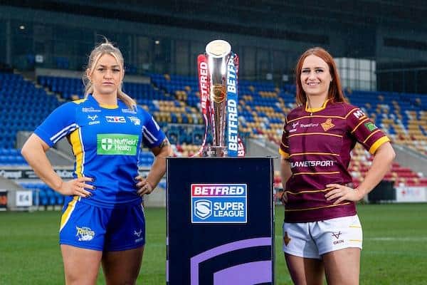 Leeds Rhinos new signing Shona Hoyle with Bethan Oates of Sunday's opponents Huddersfield Giants and the  Women's Super League trophy. Picture by Allan McKenzie/SWpix.com.