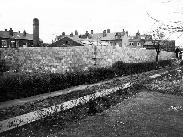 A view from the rear of the works of the South Leeds Leather Company on Mafeking Mount in March 1980. A tall chimney is visible. Terraced housing can be seen in the background, on Back Mafeking Mount on the left and on Mafeking Mount and Mafeking Grove in the centre.