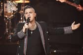 Robbie Williams was among the acts set to play the two-day festival. (Photo: JENS MEYER/POOL/AFP via Getty Images)