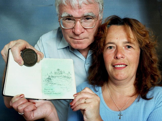 Mike and Diane Wilson of Bridlington with a medal which they have tracked down which was won by sculptor George Walker Milburn of York in 1863. He later completed a statue of Queen Victoria in York.
