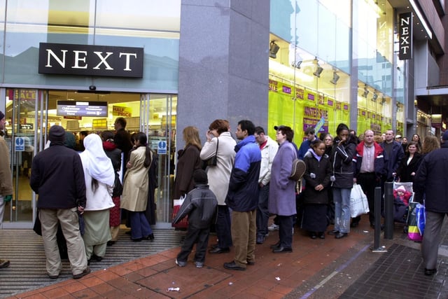 Bargain hunters queue outside Next for the New Year sales on Albion Street, Leeds, on December 27, 2001.