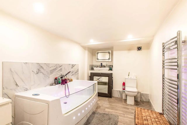 In the apartment there is a Jacuzzi bath, low level flush WC, vanity sink unit and a chrome heated towel rail.