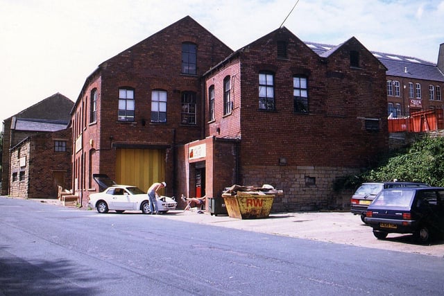 Part of Crank Mill on Station Road. This photo was taken in July 1994, 15 years after the mill closed. Some of the mill buildings are in use for other purposes here, but only the oldest part of the mill on the extreme left of the picture is a listed building.