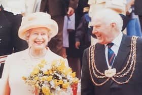 The Queen and Brian North during a visit in 2002.