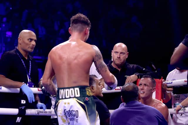 REMATCH RESPONSE - Leigh Wood checks on Josh Warrington after winning the WBA World Featherweight title fight Utilita Arena Sheffield. The champion has responded to Warrington on Instagram to suggest they can rematch next year. Pic: James Chance/Getty Images)