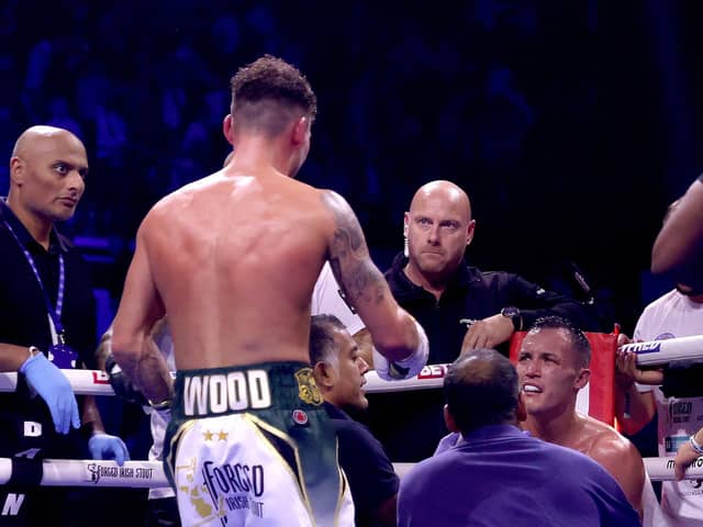 REMATCH RESPONSE - Leigh Wood checks on Josh Warrington after winning the WBA World Featherweight title fight Utilita Arena Sheffield. The champion has responded to Warrington on Instagram to suggest they can rematch next year. Pic: James Chance/Getty Images)