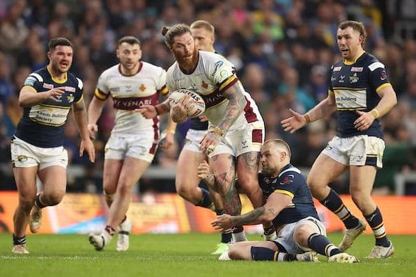 Giants' Chris McQueen is tackled by Blake Austin during Leeds' win at Headingley two months ago. Picture by John Clifton/SWpix.com.