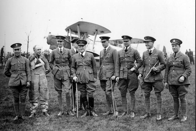 Officers of the R.A.F. pose for a photograph on a visit to Leeds in April 1927. In the background is a Hawker Horsley bomber, one of 112 built between July 1926 and November 1931.