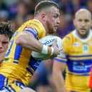 Brad Singleton in action for Leeds Rhinos during the 2018 World Club Challenge against Melbourne Storm in Australia. The tackler is current Rhinos stand-off Brodie Croft. Picture by Brendon Ratnayake/SWpix.com/PhotosportNZ.
