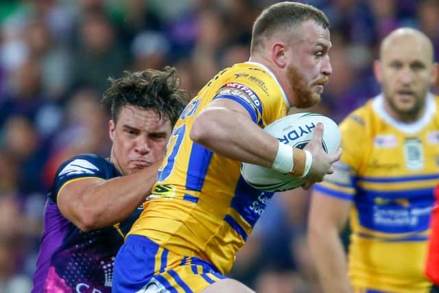 Brad Singleton in action for Leeds Rhinos during the 2018 World Club Challenge against Melbourne Storm in Australia. The tackler is current Rhinos stand-off Brodie Croft. Picture by Brendon Ratnayake/SWpix.com/PhotosportNZ.
