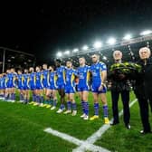 Leeds Rhinos players - along with his former teammates Alan Smith and Derek Hallas - observe a minute's silence for club great Lewis Jones, who died two weeks ago. Picture by Allan McKenzie/SWpix.com.