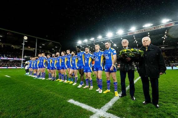 Leeds Rhinos players - along with his former teammates Alan Smith and Derek Hallas - observe a minute's silence for club great Lewis Jones, who died two weeks ago. Picture by Allan McKenzie/SWpix.com.