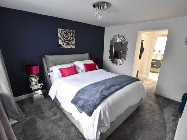 To the first floor, a landing gives access to a beautiful master bedroom which has four skylight windows, opposite, there is also a dressing room with a good range of built-in storage and dressing table and wardrobes.
