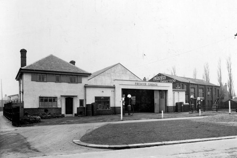 Premier Garage - proprietor Percy Boddy - on Avenue Road, now called Cross Gates Road. Charles Linson, funeral director can be seen on the right. Pictured in Marc h 1936.