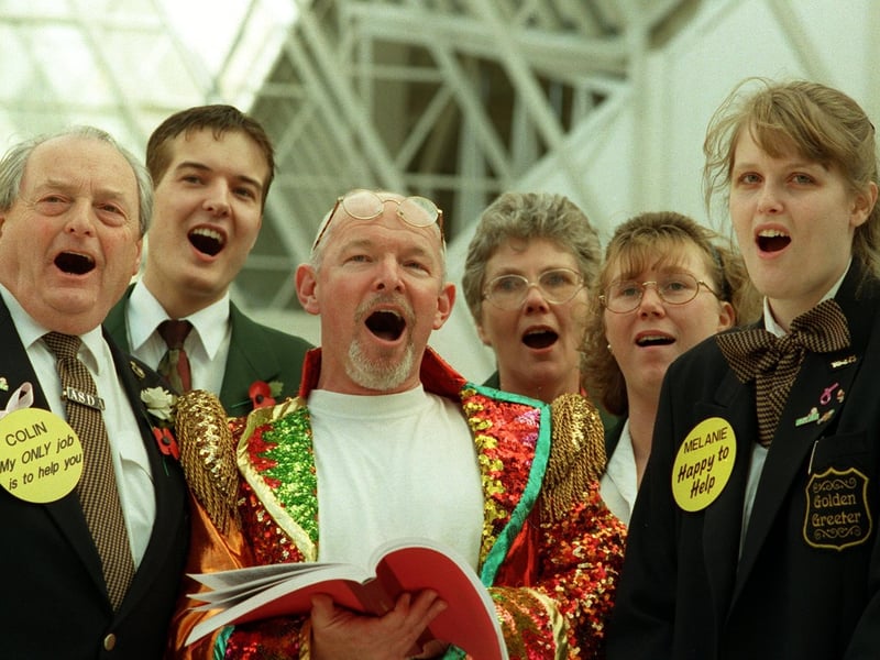 David Owen-Lewis from Opera North teaching Asda 'greeters' some songs to welcome their customers with at the Owlcotes Centre store in November 1998.