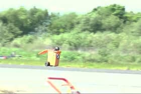 Video grab of Michael Wallhead in his wheelie bin at Elvington Airfield. Picture: Naomi Shaw / SWNS