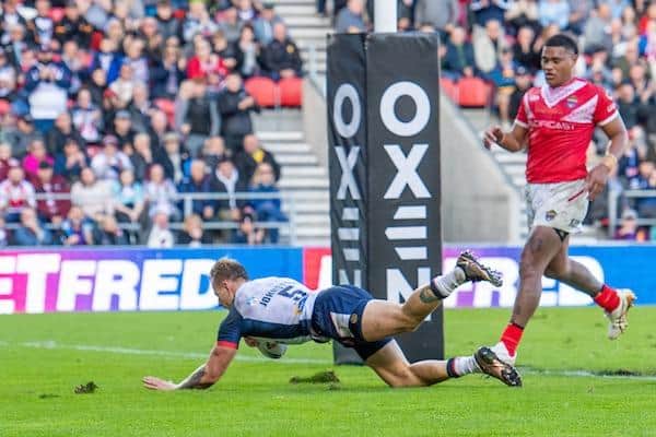 Tom Johnstone scores for England during the first Test win over Tonga at St Helens. Picture by Olly Hassell/SWpix.com.