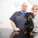 Senior vet Fraser Reddick with Ellie Holbrook and Dachshund Nellie at Chantry Vets in Wakefield. Photo: Chantry Vets