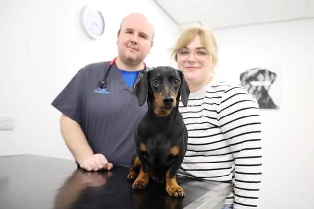 Senior vet Fraser Reddick with Ellie Holbrook and Dachshund Nellie at Chantry Vets in Wakefield. Photo: Chantry Vets