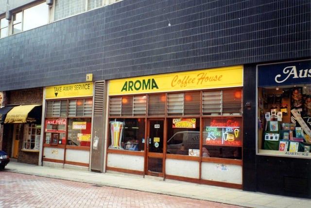 Aroma Coffee House on King Charles Street. To the left is Bianco Hair World and on the right Austicks' Bookshop.