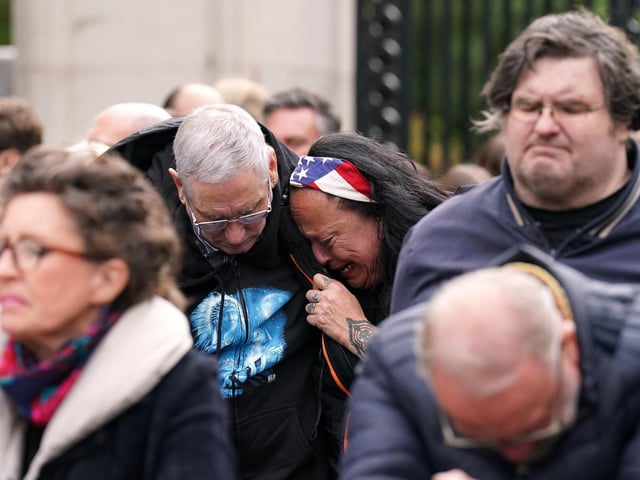 Members of the public on the Mall listen to the State Funeral