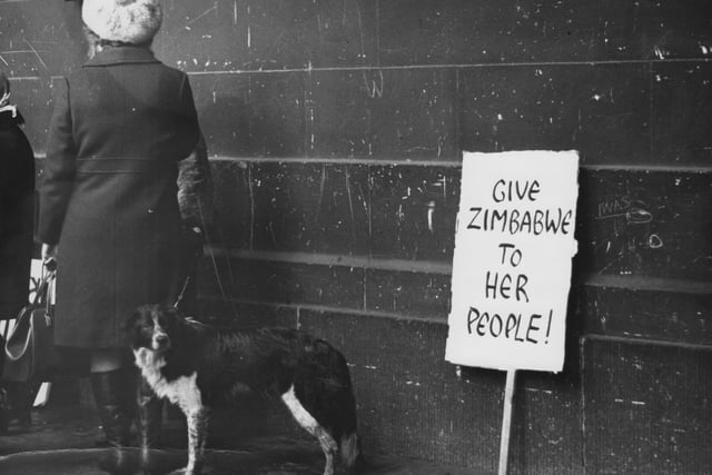 A protest banner leant against a wall in Leeds city centre reads 'Give Zimbabwe to Her People' as in that year guerilla warfare against white rule and the fight for independence had escalated.