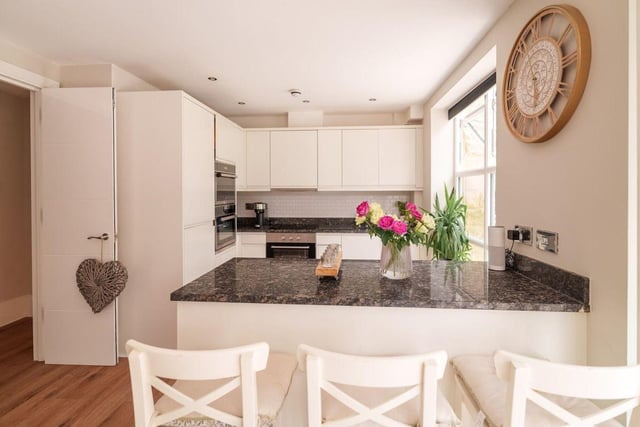 The kitchen is finished to a high standard with a high specification, integrated appliances, granite worktops, breakfast bar, air conditioning unit and beautiful bi folding doors leading to the terrace