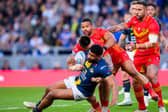 Leeds Rhinos' Kallum Watkins, who played for England in last year's Ashes, is tackled by Catalan Dragons' Zac Lipowicz and Kruise Leeming during last night's game at AMT Headingley which the hosts won 46-4. Picture by Allan McKenzie/SWpix.com.