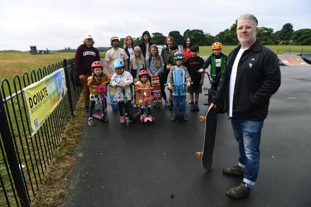 Paul Donnelly from the Roundhay Skatepark Project Committee with local residents and skaters, raising money to open a new skate park in Roundhay Park.