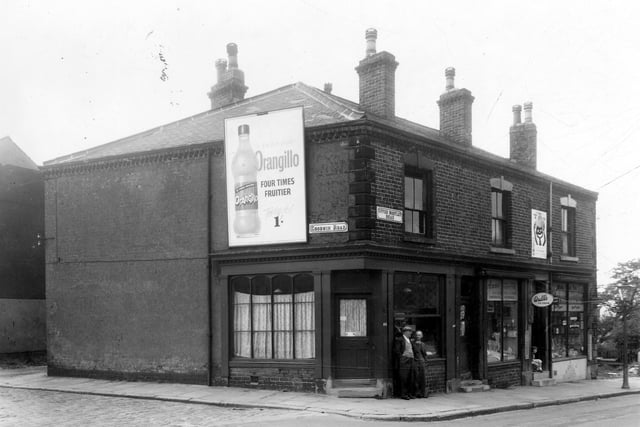 Goodwin Road is to the left, at the corner with Upper Wortley Road is a shop, number 102. Next a ladies and childrens clothing business at 100 'Annes'. To the right number 98 is a grocers run by Eva M. Leggot.