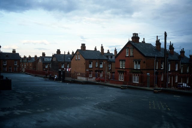 A view from the playground of Quarry Mount Primary School looking towards Cross Quarry Street in August 1985. Streets of terraced housing leading off are (from right) Bolland Street, Thomas Street, Quarry Place, Quarry Street and Christopher Road. Quarry Street continues on the far left while Cross Quarry Street becomes Glossop Street in the distance.
