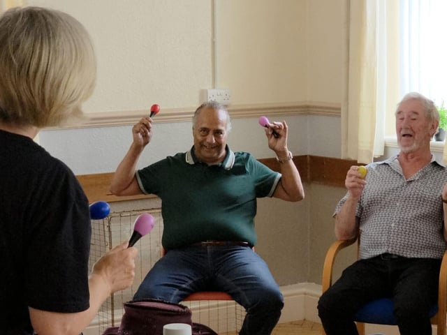 Taking part in music and exercise sessions