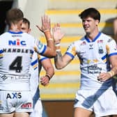 Riley Lumb, right, celebrates after completing his hat-trick in Leeds Rhinos' big win at York Knights. Picture by Matthew Merrick/SWpix.com.
