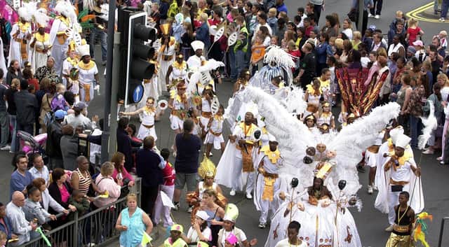 Leeds West Indian Carnival. Picture shows part of the procession in Roundhay Road, Leeds on August 25, 2003.