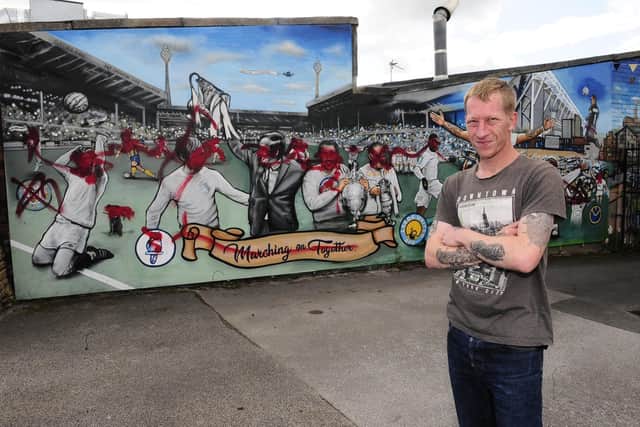 Martin Walsh, landlord of The Daisy in Bramley with the vandalised mural. (picture Steve Riding)