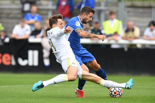 Diego Llorente of Leeds United challenges Aitor of Real Betis during the Pre-Season Friendly match between Leeds United and Real Betis at Loughborough University (Photo by Tony Marshall/Getty Images)