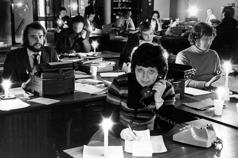 YEP editorial staff work with the use of paraffin lamps and candles in February 1972.