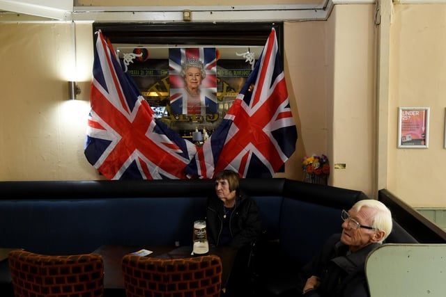 The Regent was decked out with Union Jack flags and a picture of Queen Elizabeth as drinkers watched the service