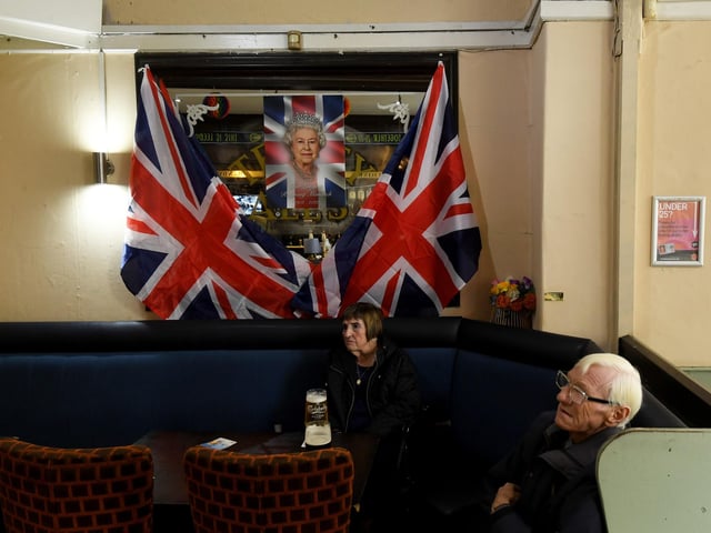 The Regent was decked out with Union Jack flags and a picture of Queen Elizabeth as drinkers watched the service